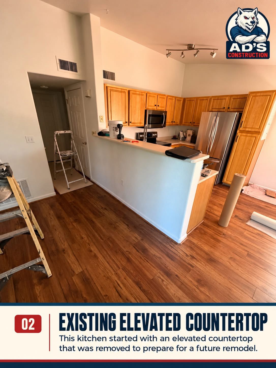 Existing elevated bar countertop on a half wall in a Littleton condo kitchen before removal