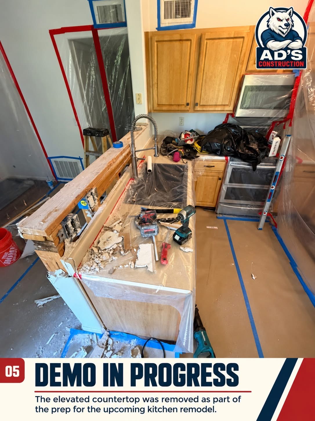 Kitchen demo in progress in a Littleton condo with the elevated countertop removed and floors covered